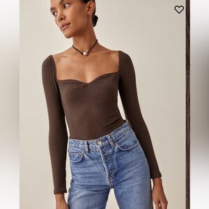 Reformation October top in cafe